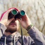 Citizen scientist using binoculars